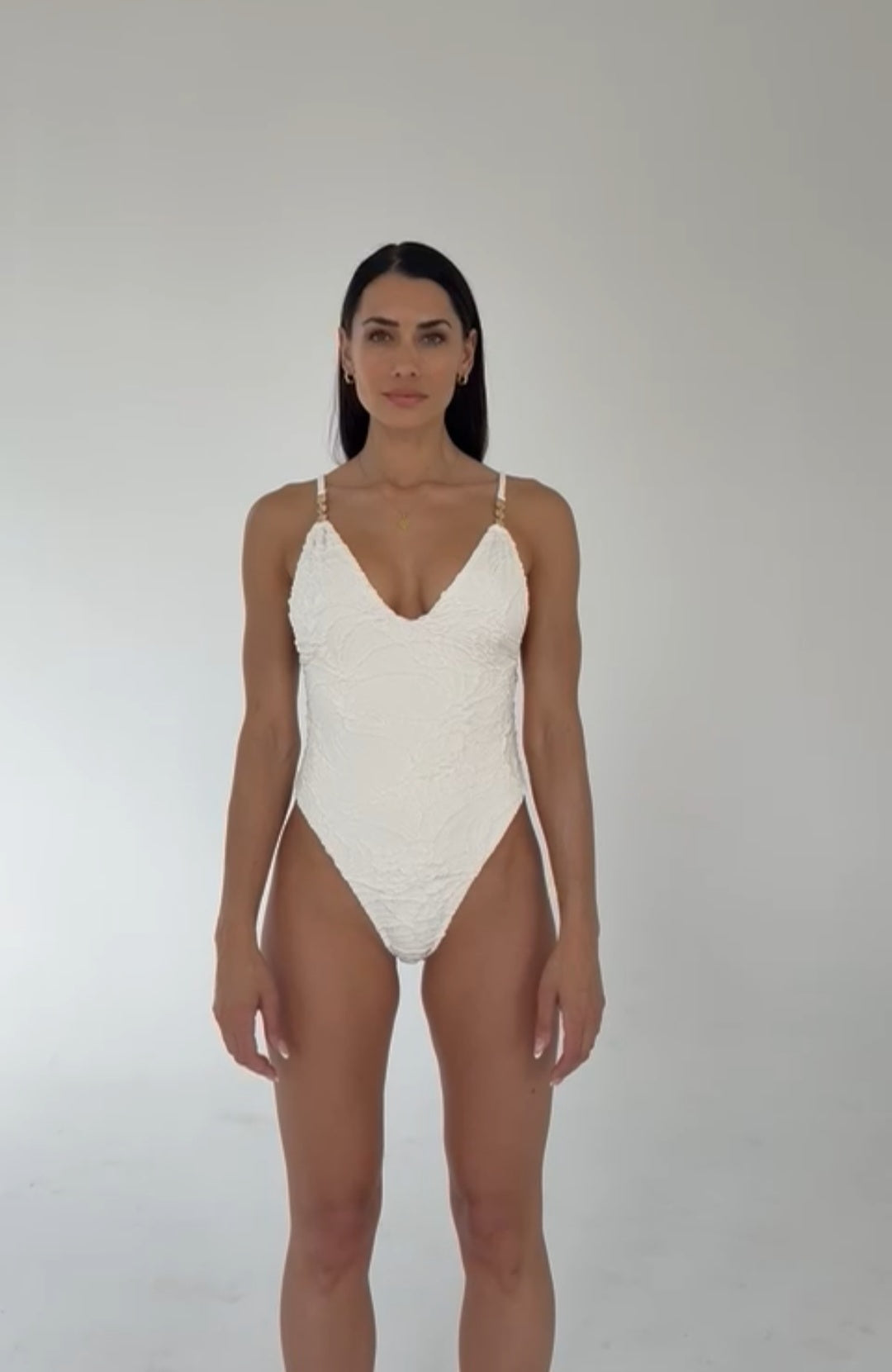 model wearing full coverage floral white high quality luxury one-piece swimsuit